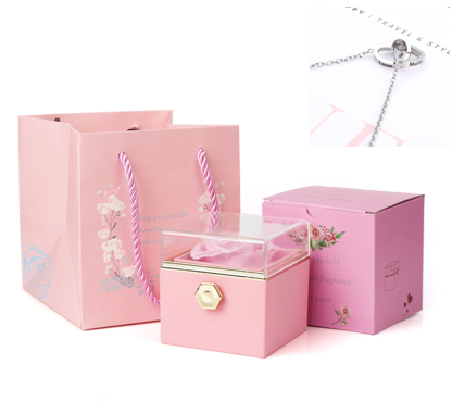 Heart-shaped necklace and rotating rose jewelry box