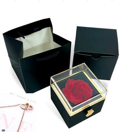 Heart-shaped necklace and rotating rose jewelry box