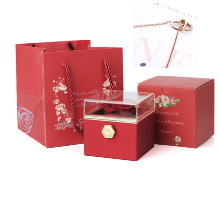 Heart-shaped necklace and rotating rose jewelry box