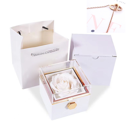 Heart-shaped necklace and rotating rose jewelry box